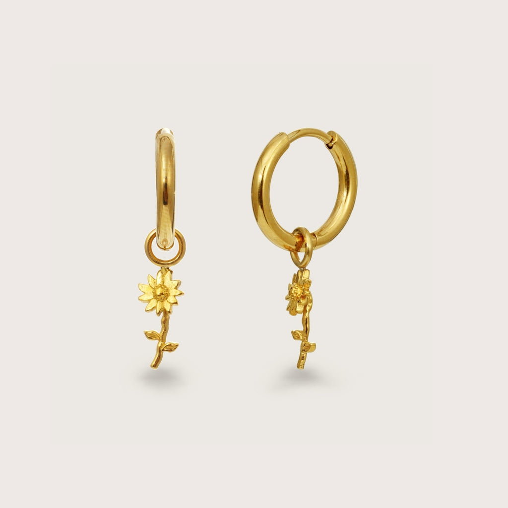 Aros Huggie con Charm de Girasol Dorados